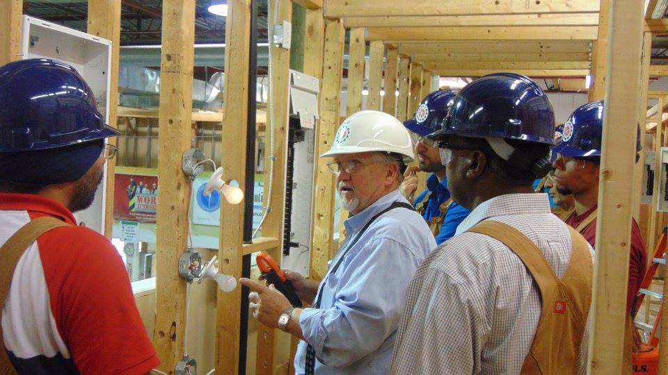 Instructor talking to electrical pre-apprenticeship students