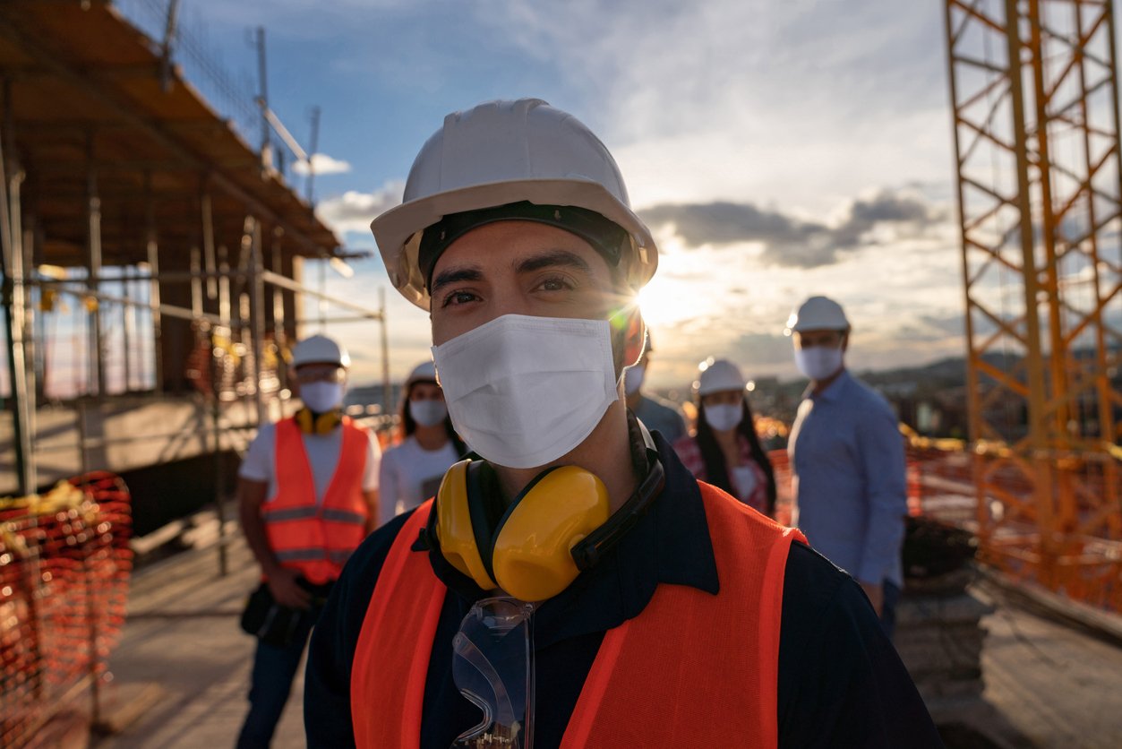 Happy construction worker at a building site