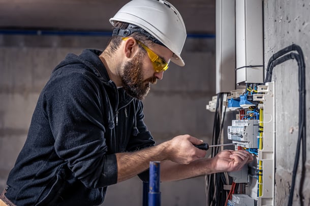 Electrician working on a switchboard