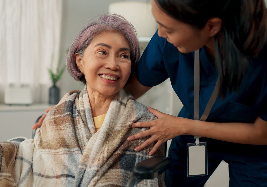 Caregiver and patient smiling