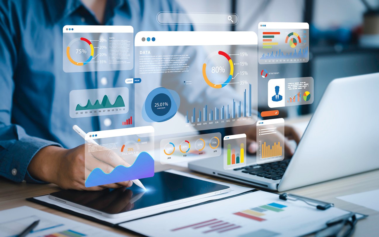 An analyst uses a computer and dashboard for data business analysis