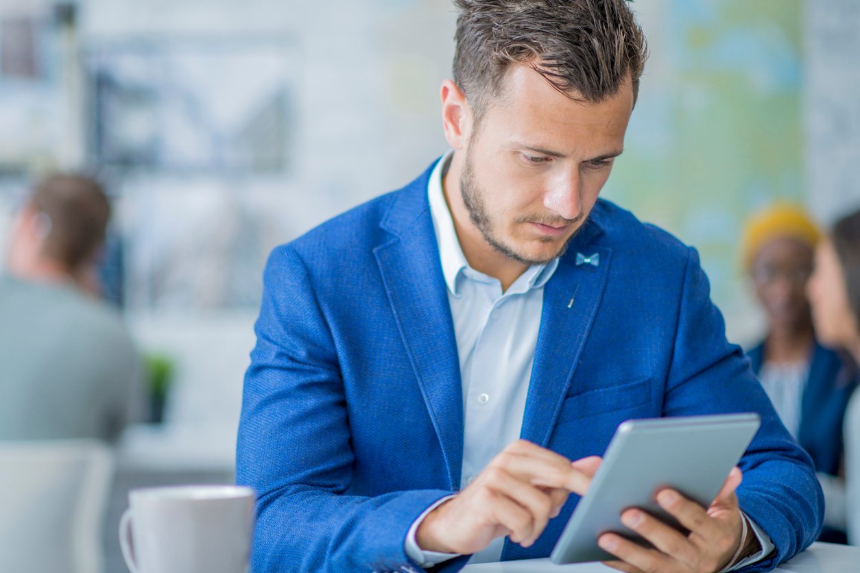 Professional man working on a tablet