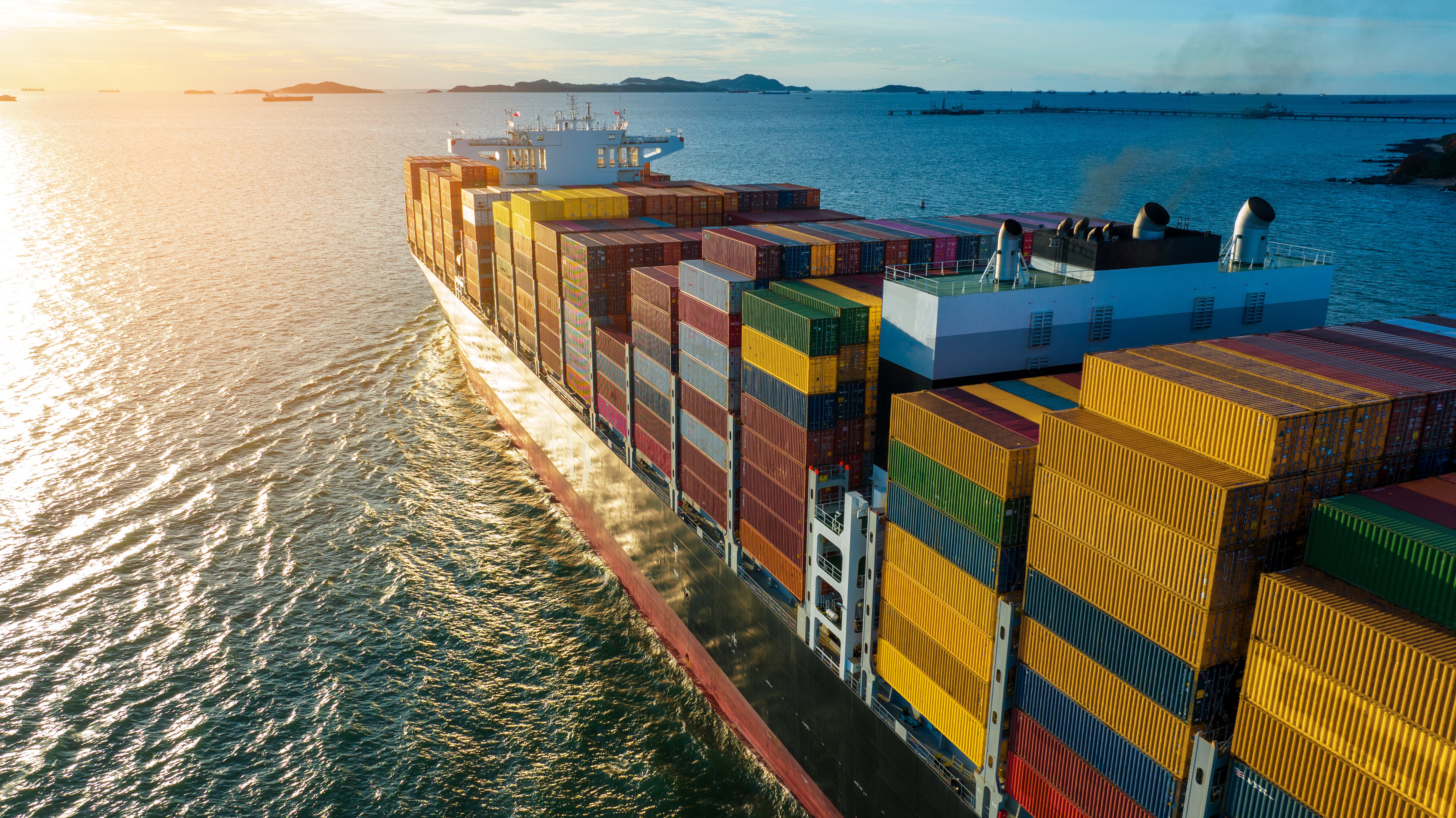 Side view of cargo ship carrying containers