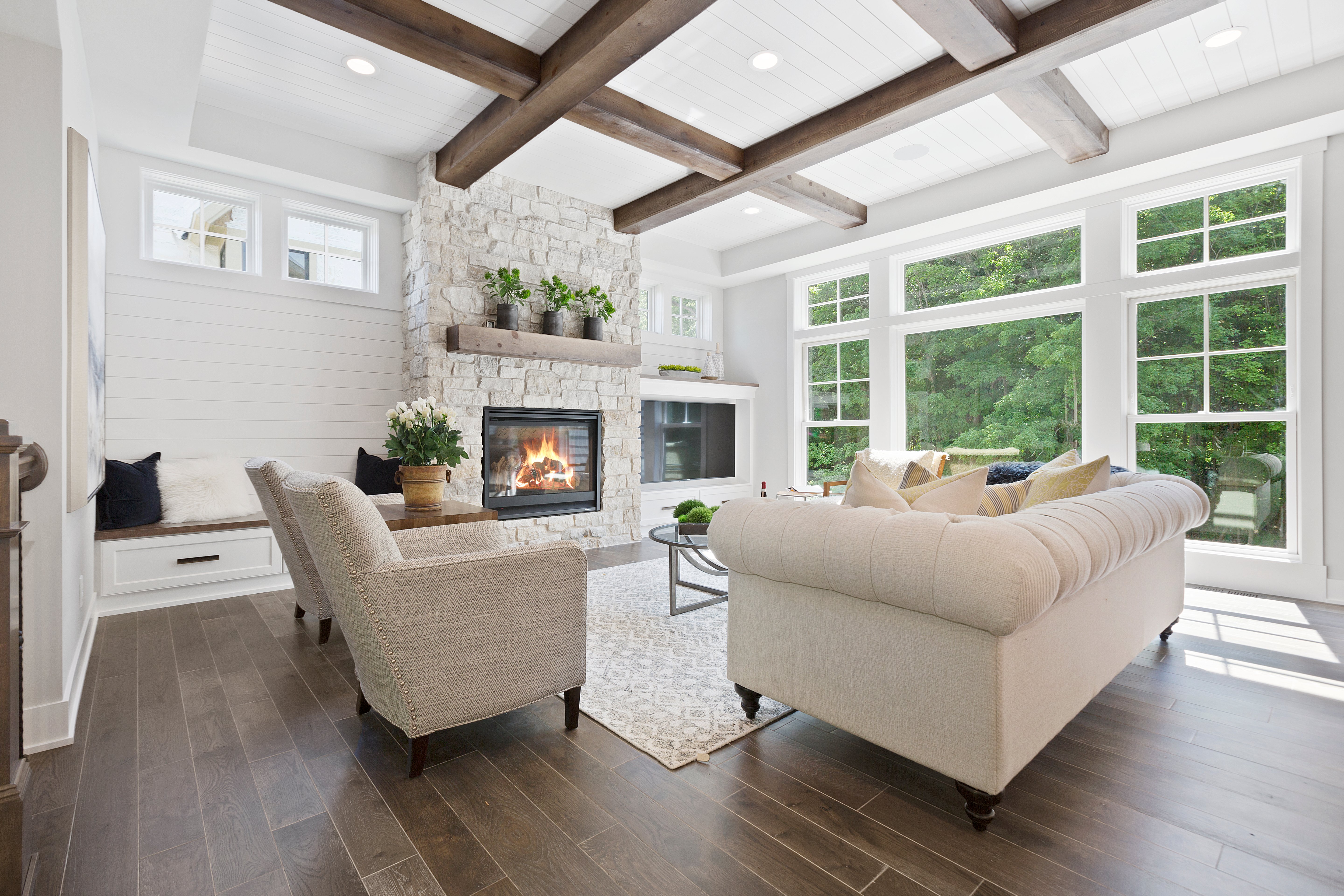 Family room with a wall full of windows