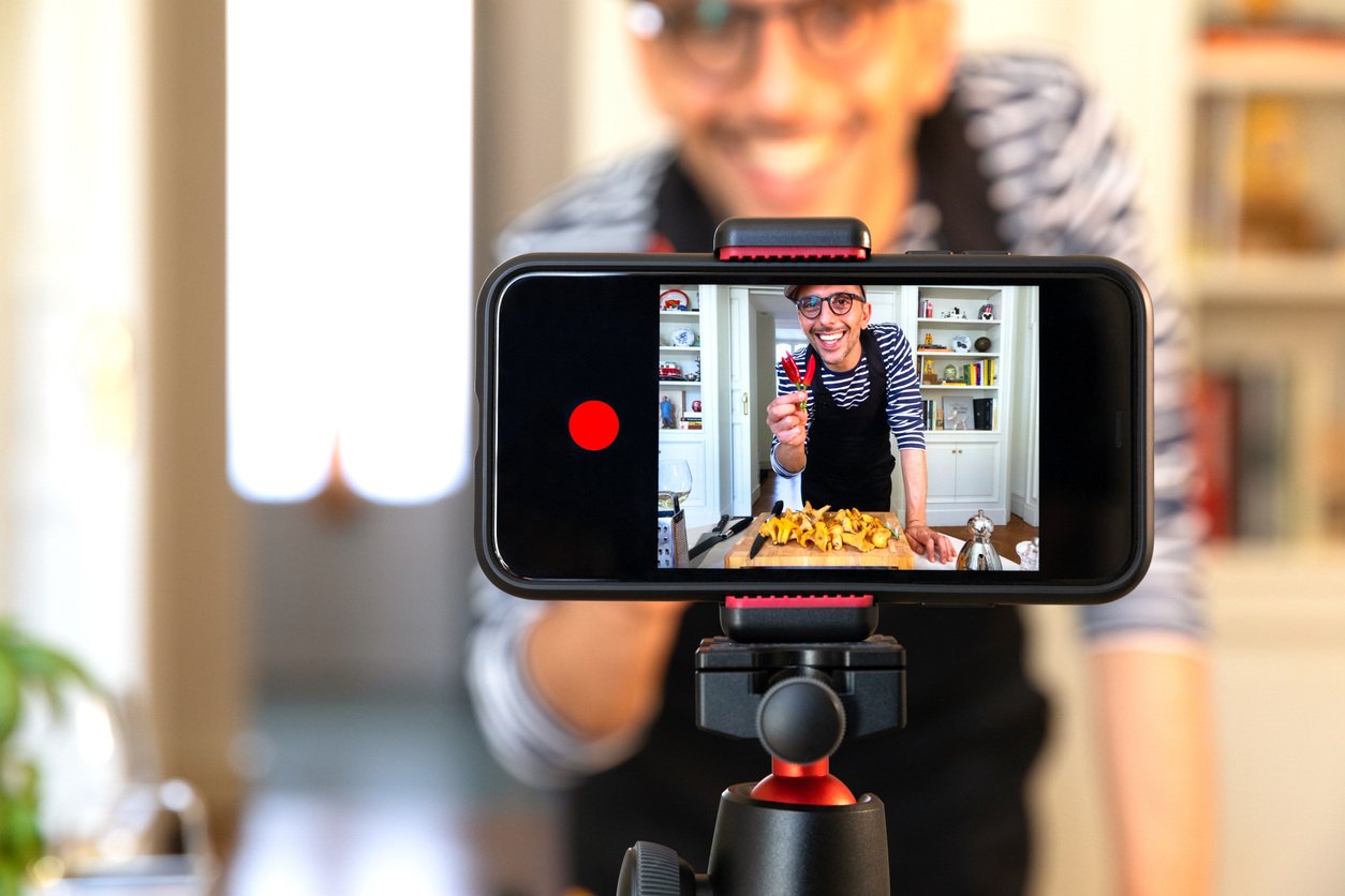 Food vlogger recording video