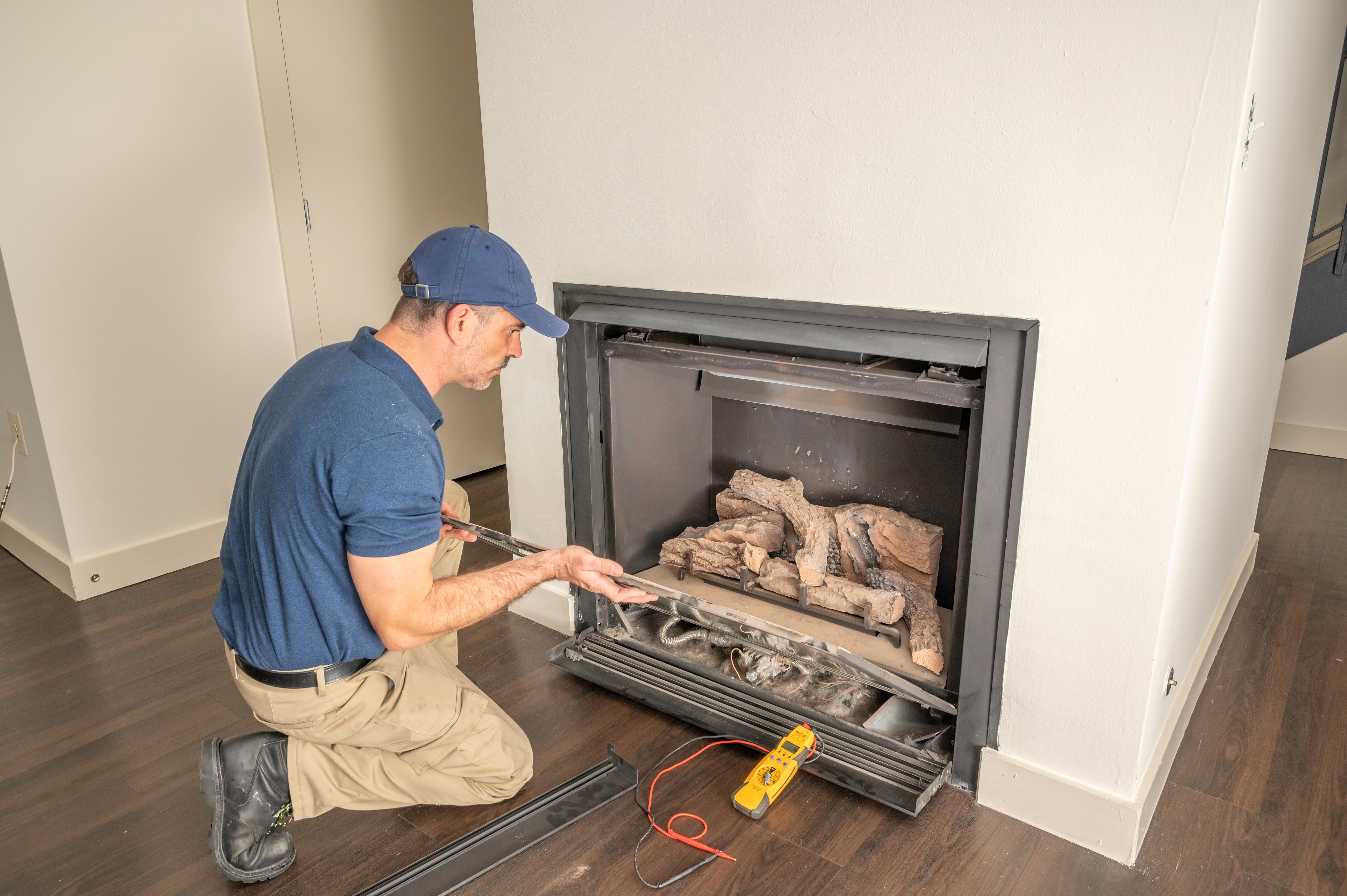 Technician working on gas fireplace