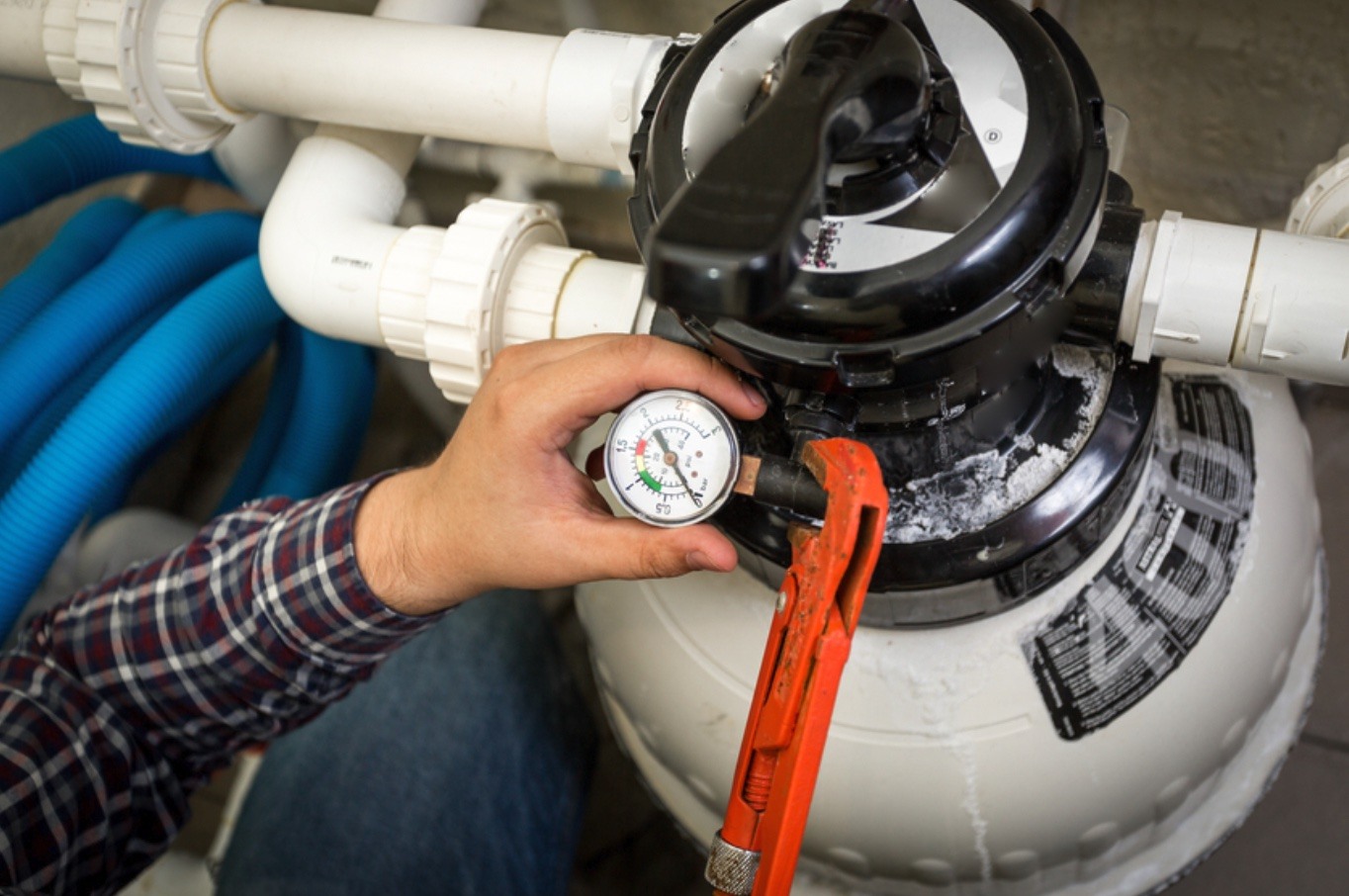 Technician adjusting valve