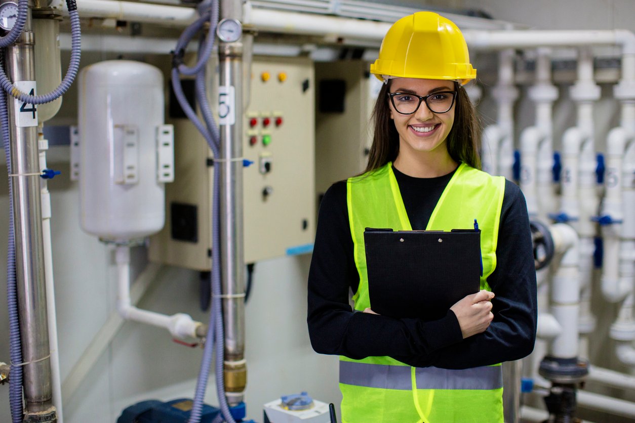 Smiling female gas fitter