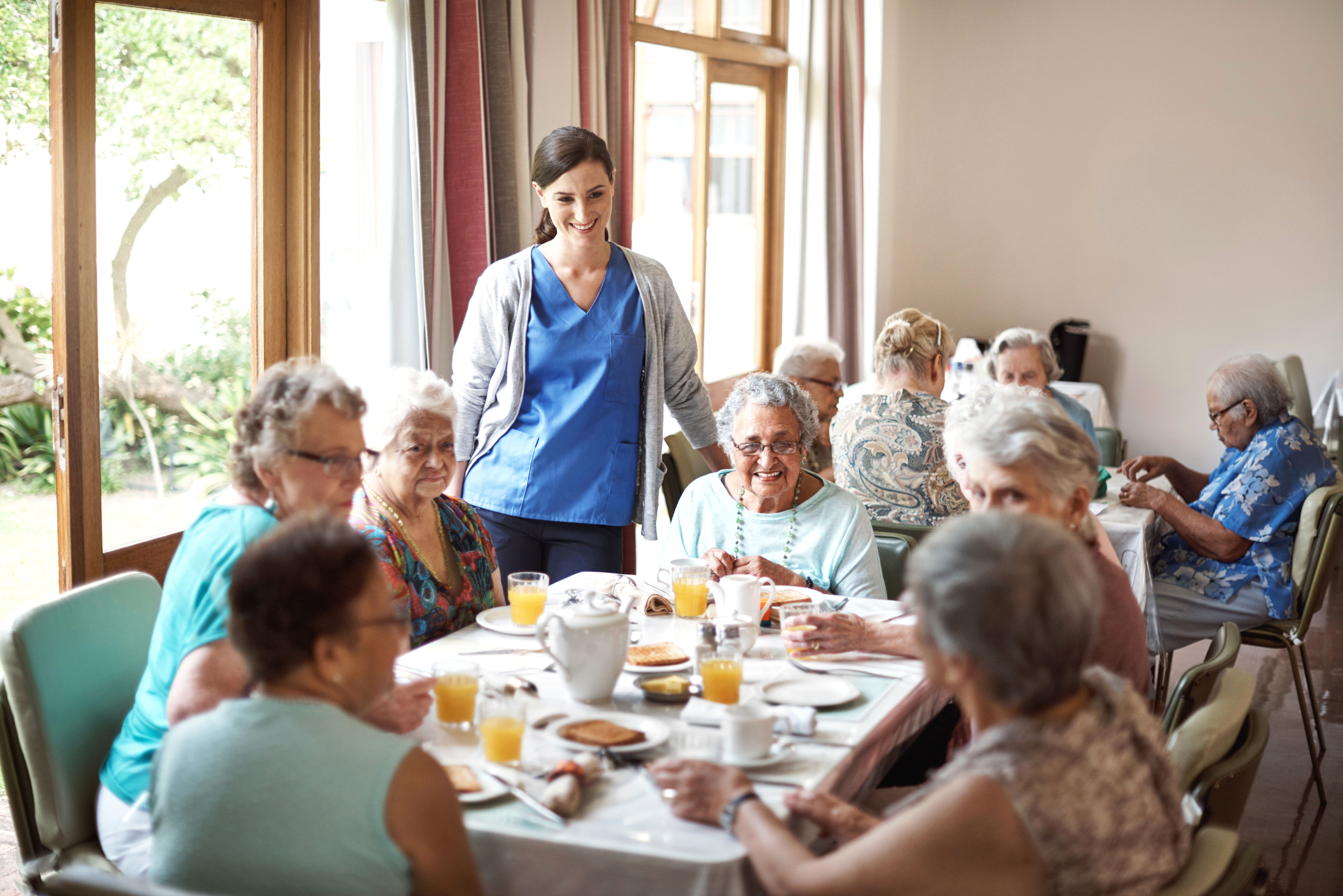 PSW supervising breakfast in a retirement residence