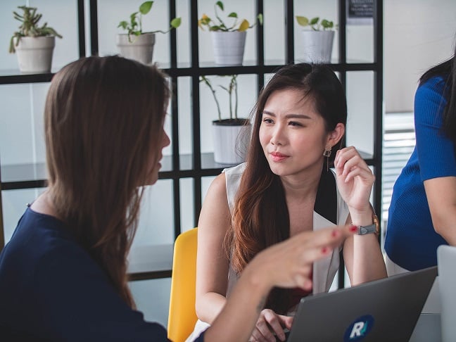 Two women discussing job performance