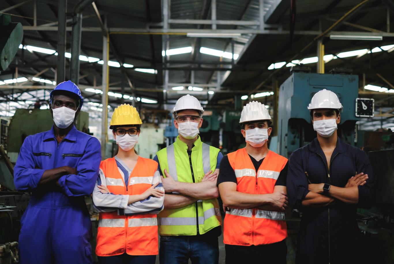 A group of workers in personal protective equipment