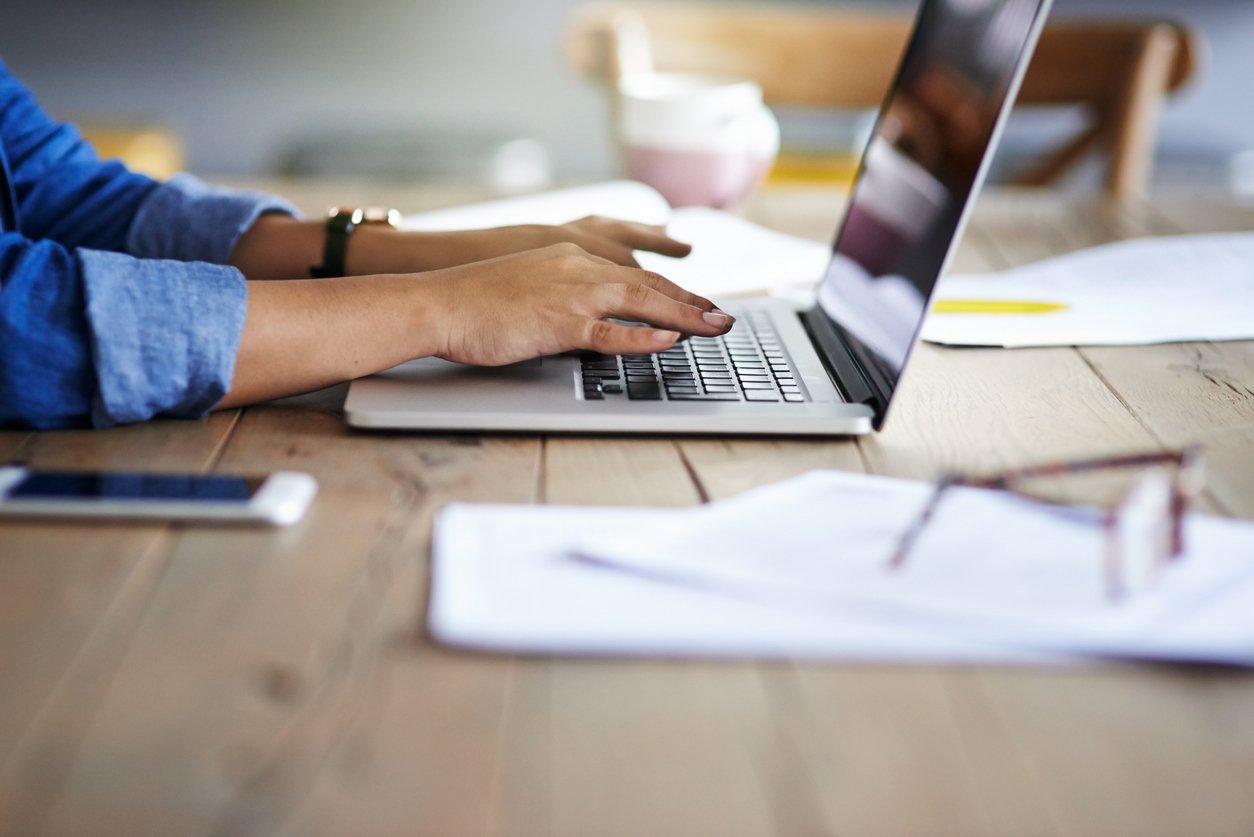 Cropped shot of a person using a laptop