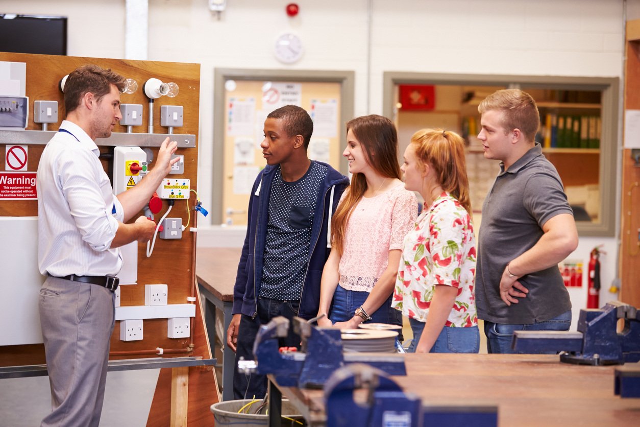 Teacher with electrical students