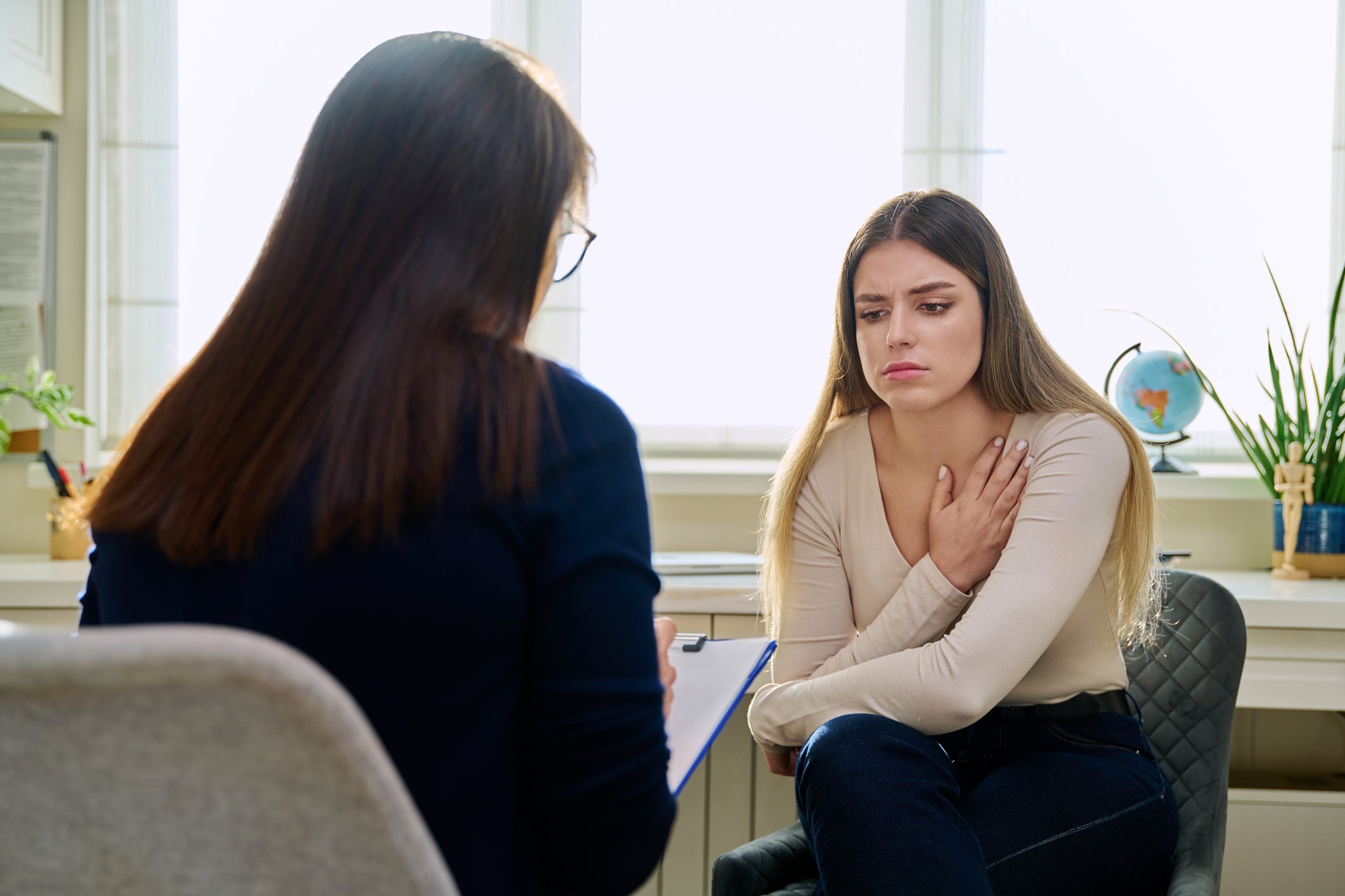 Unhappy young woman at therapy
