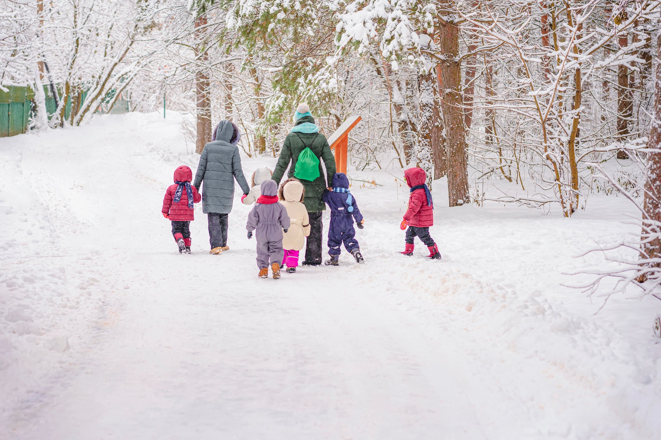 Preschool class out for a walk in the snow