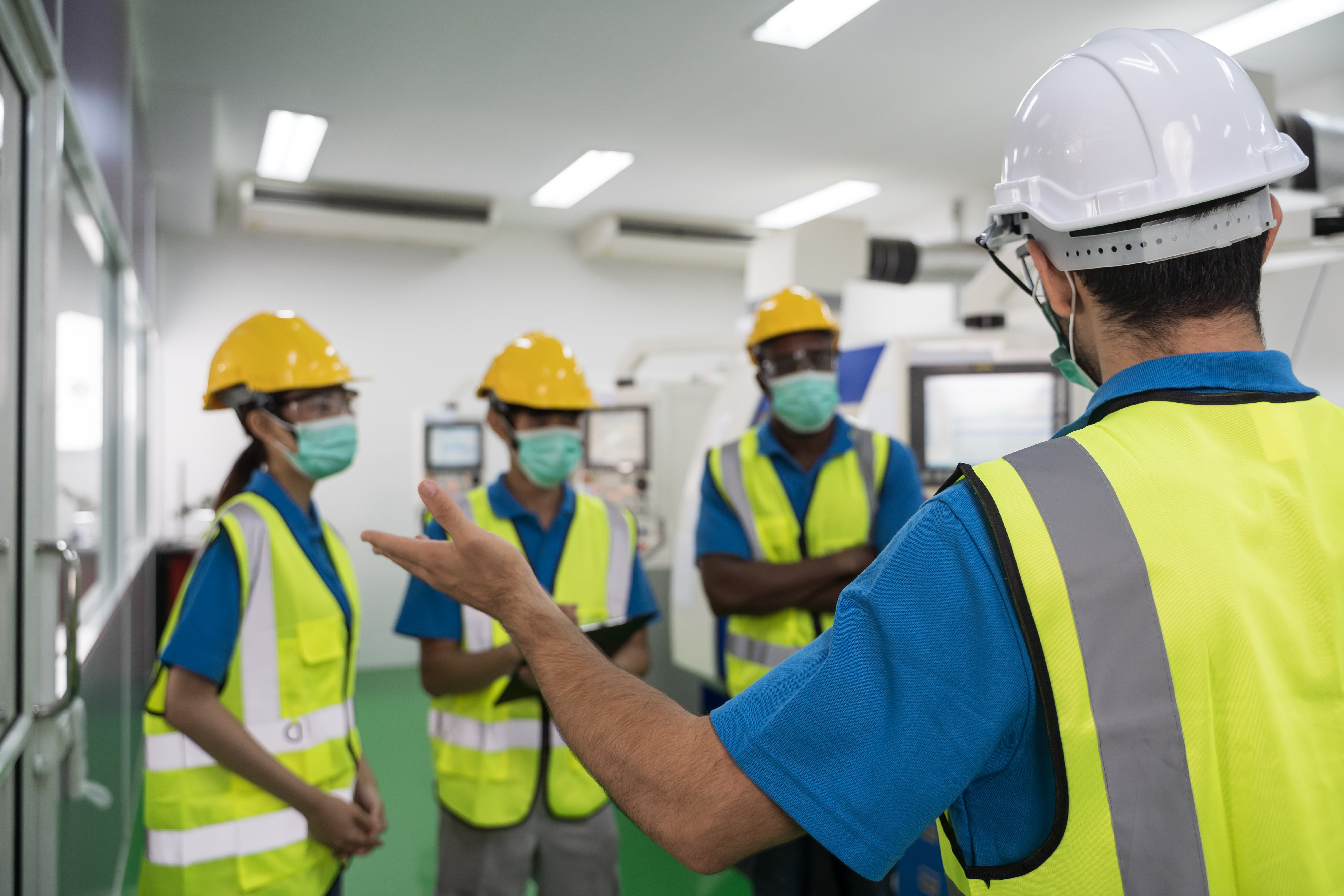 Group of factory workers in a safety training session