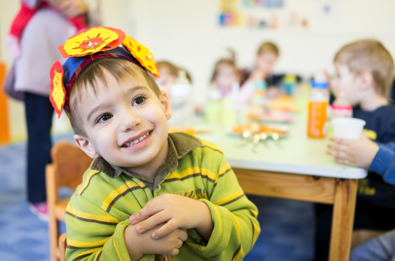 Young boy wearing a crown made in art class