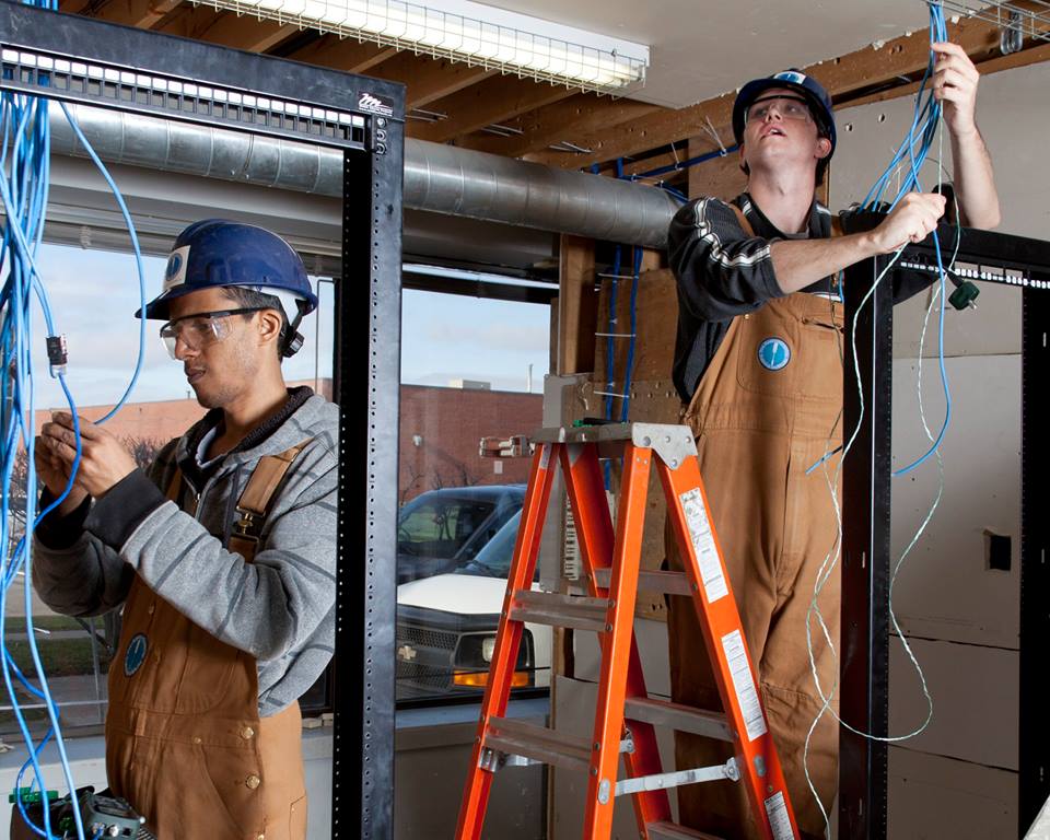 Electrician students in the Herzing College workshop