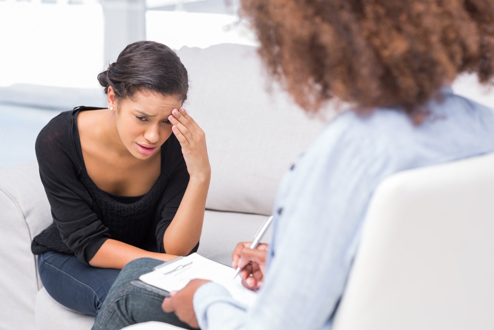 Distressed woman in counselling session