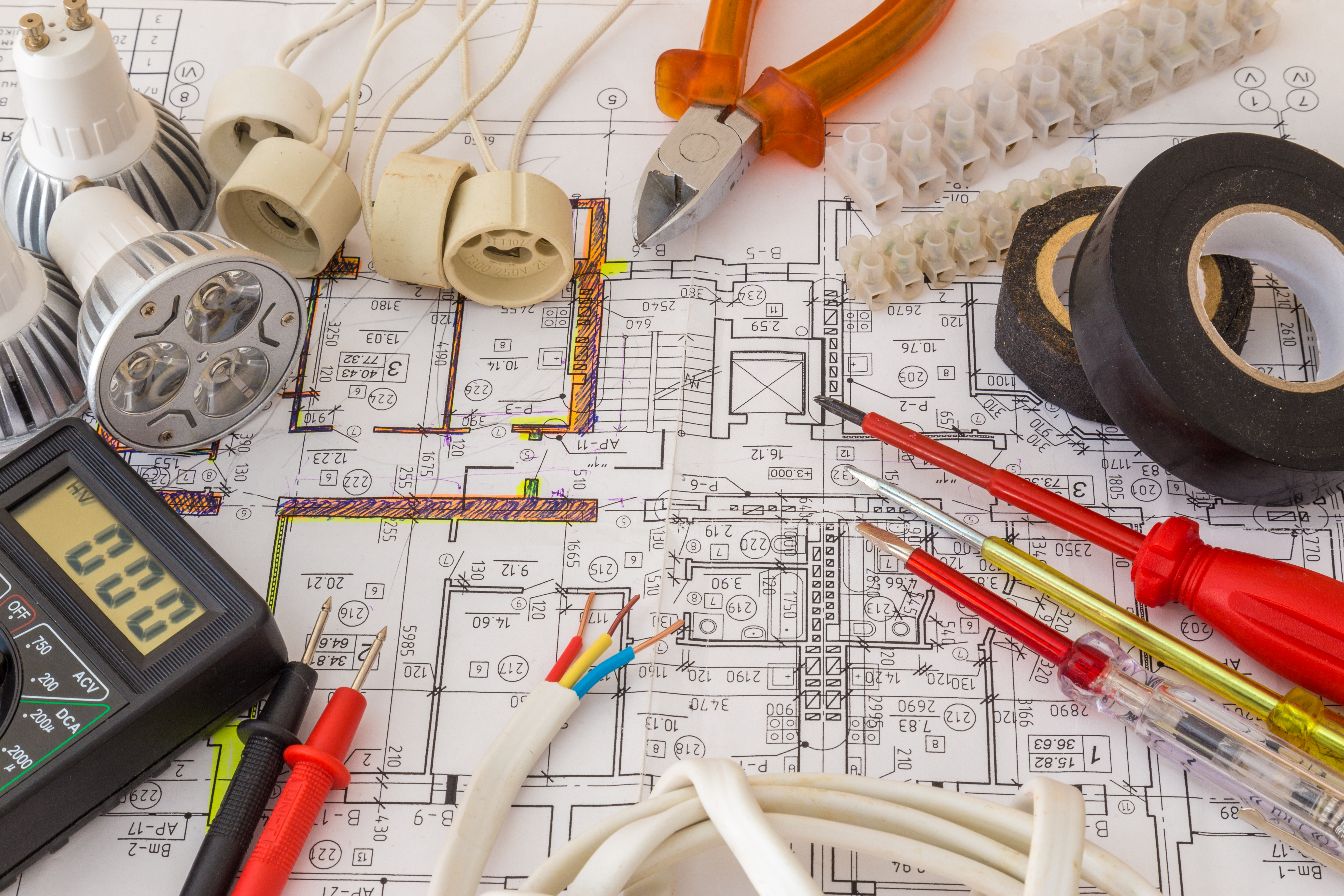 Electrical components arranged on building blueprints