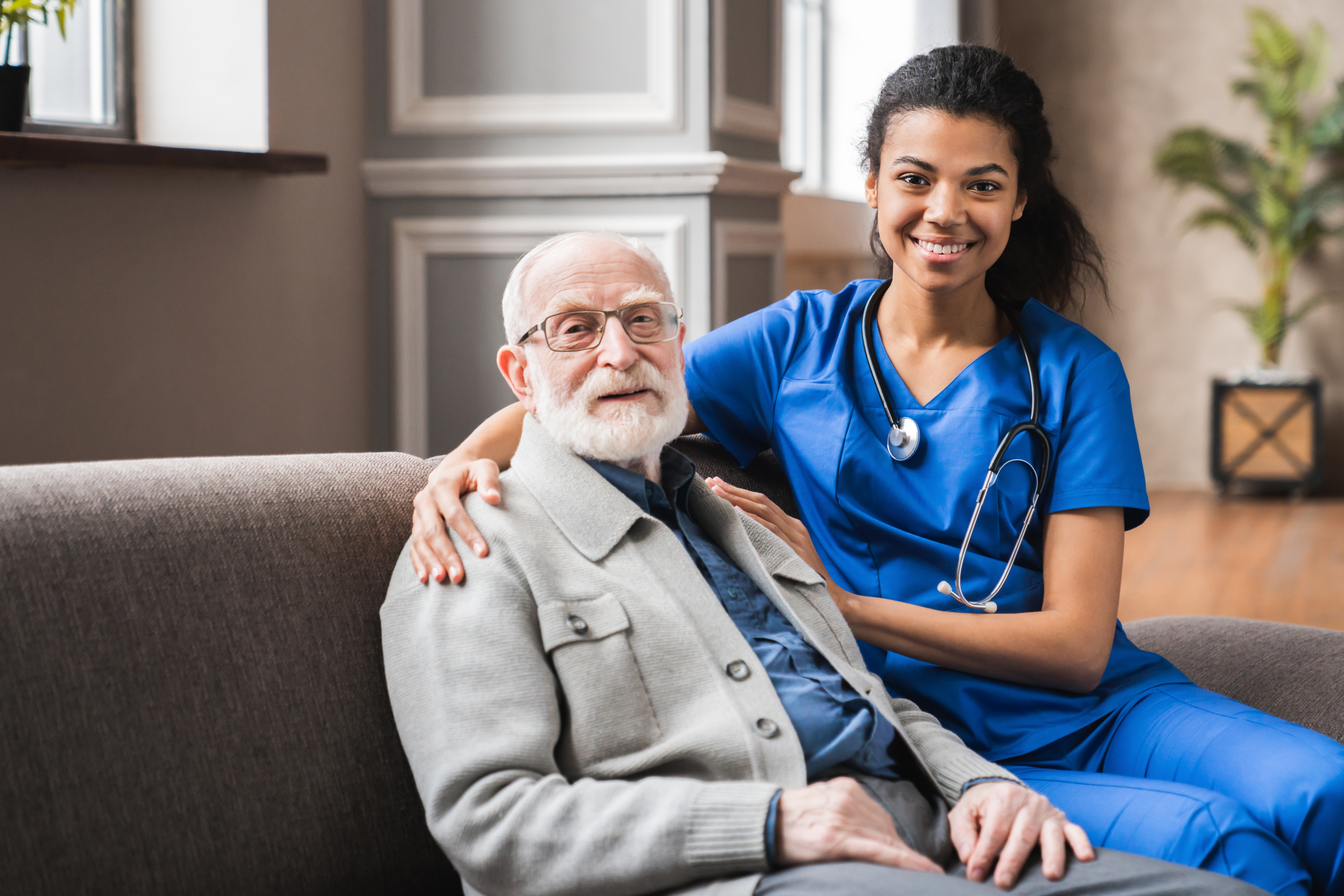 Health care aide with her arm around an elderly client