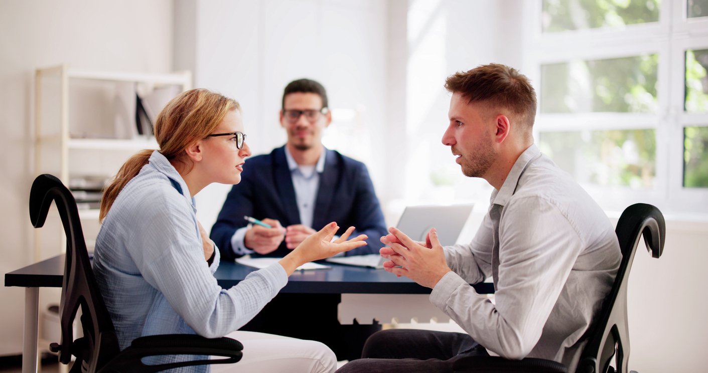 Mediator dealing with tense argument between two people