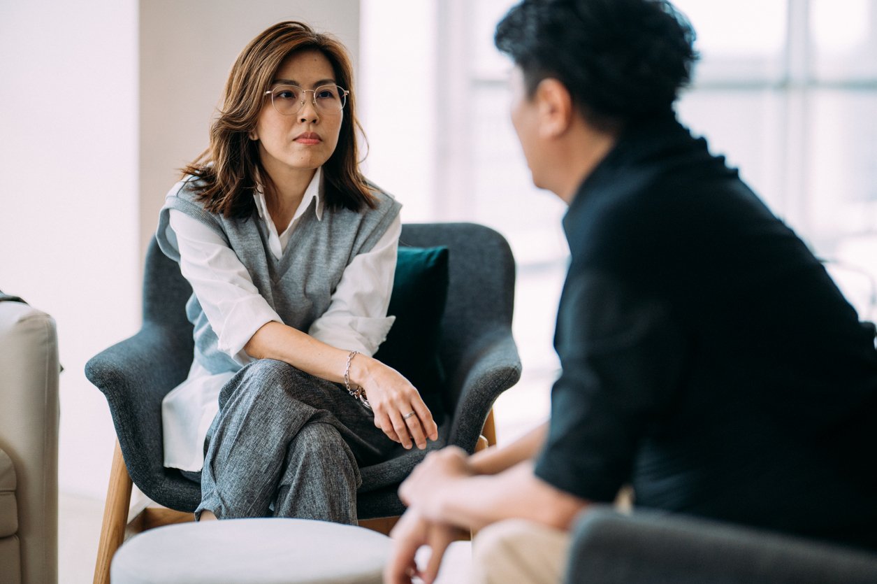 Mental health professional and client in therapy session