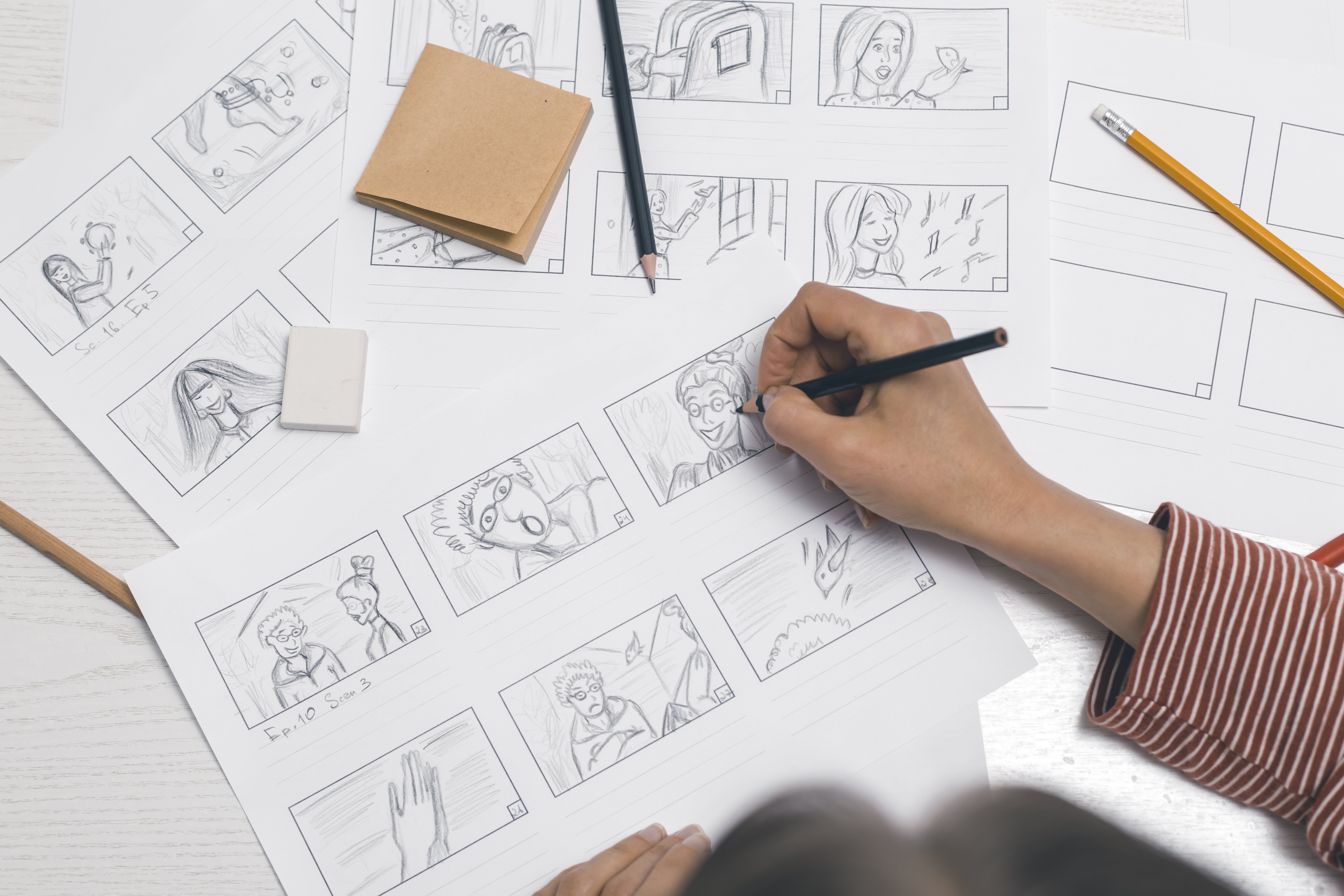 Woman’s hand draws a storyboard for a film or cartoon