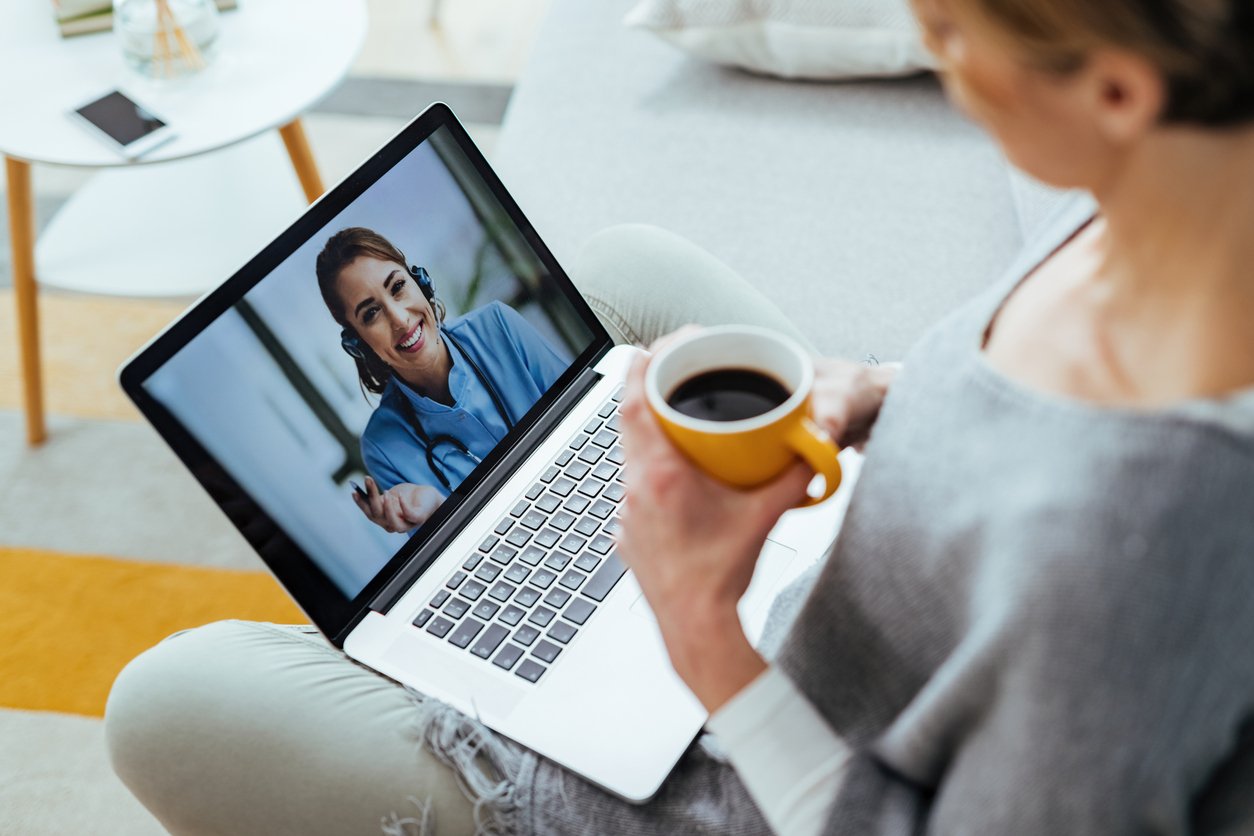 Close-up of woman having video call with healthcare professional