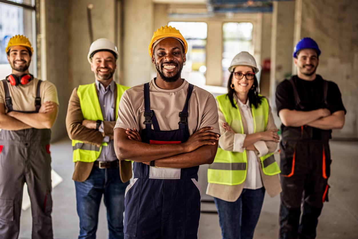 A group of smiling tradespeople