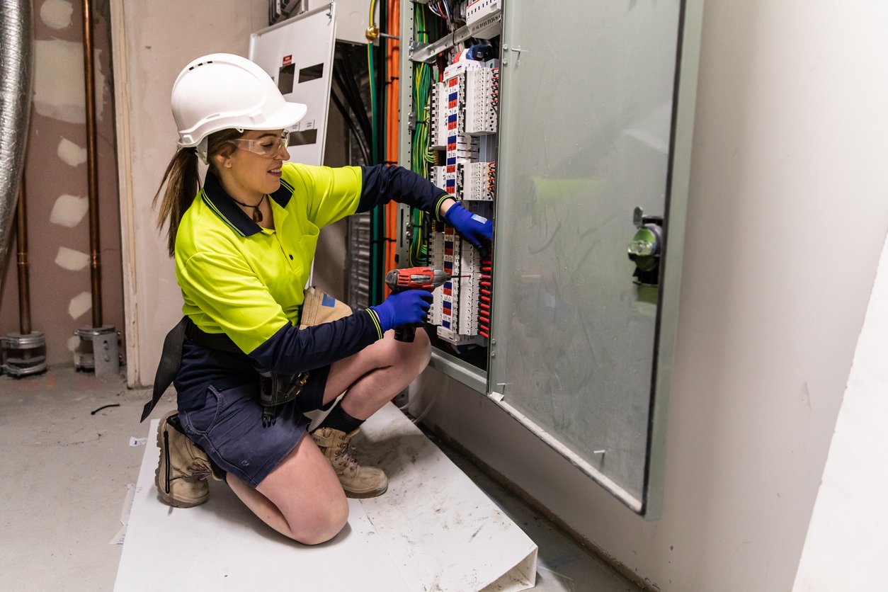 A female electrician at work